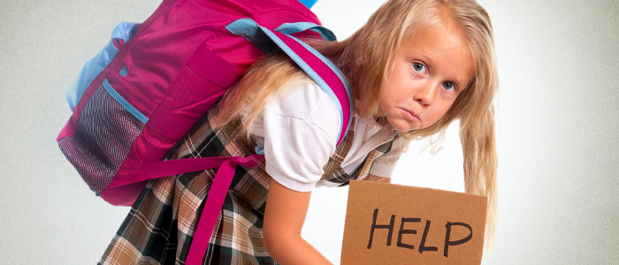 child with heavy backpack